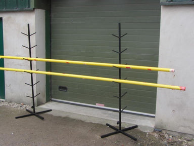 Pair of painted metal stands with 6 pairs of arms each, to hold vaulting poles